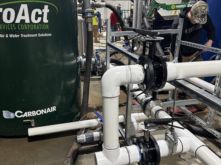 Green water treatment tanks connected with PVC piping