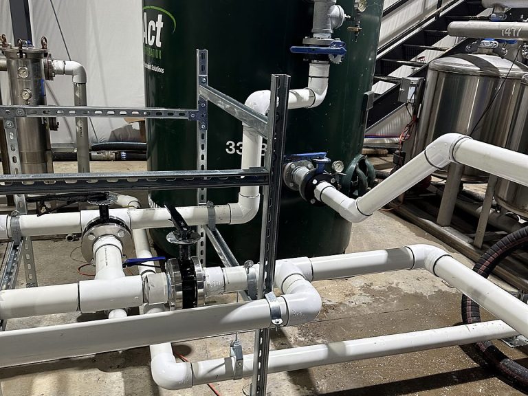 Commercial water treatment tank with PVC connections