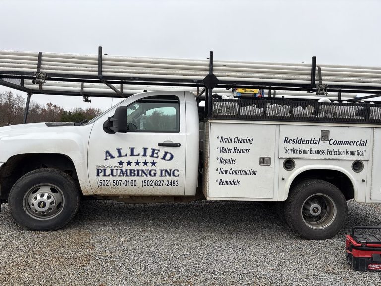 Allied Plumbing white service truck with ladder rack