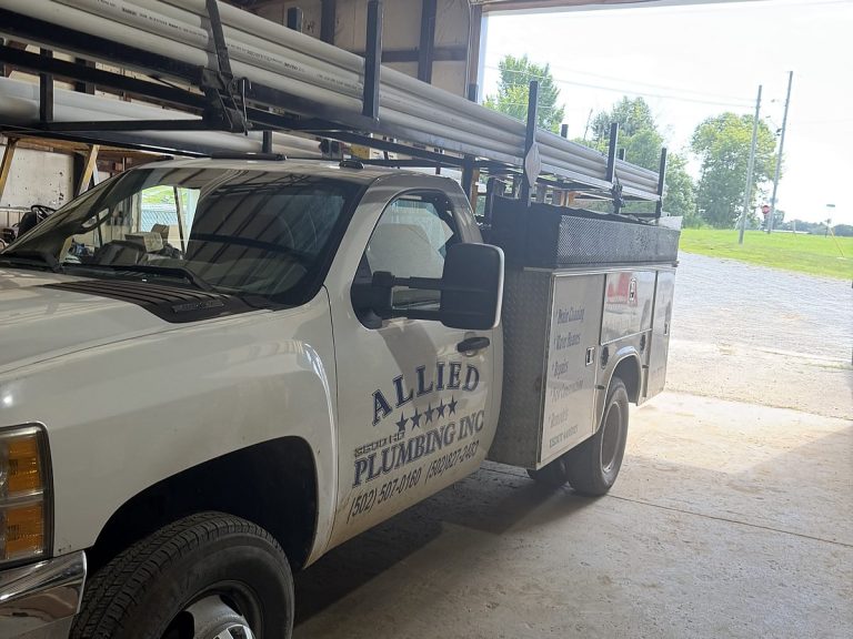 Allied Plumbing service truck parked in the shop