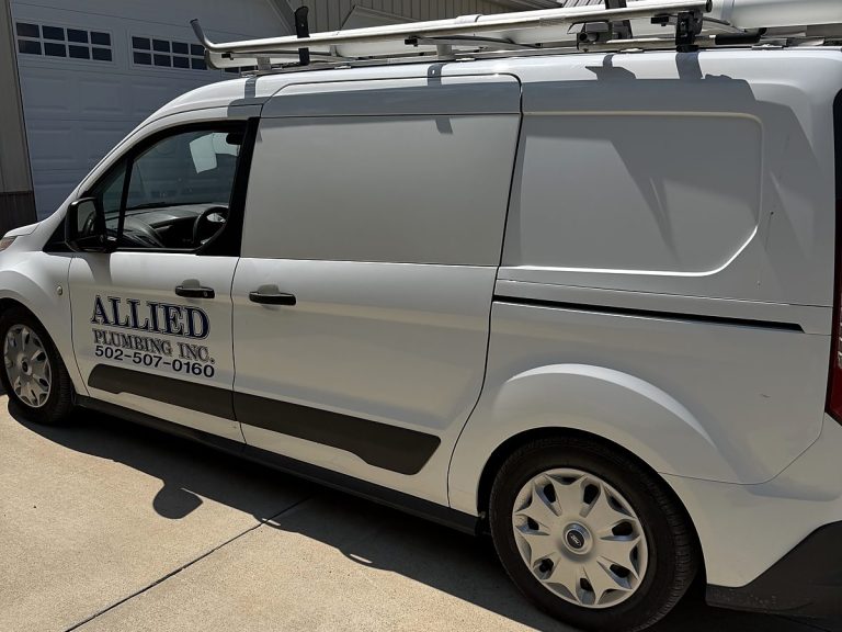 White Allied Plumbing van in a driveway
