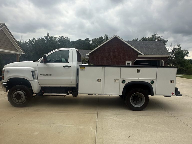 White Allied Plumbing service truck with utility bed