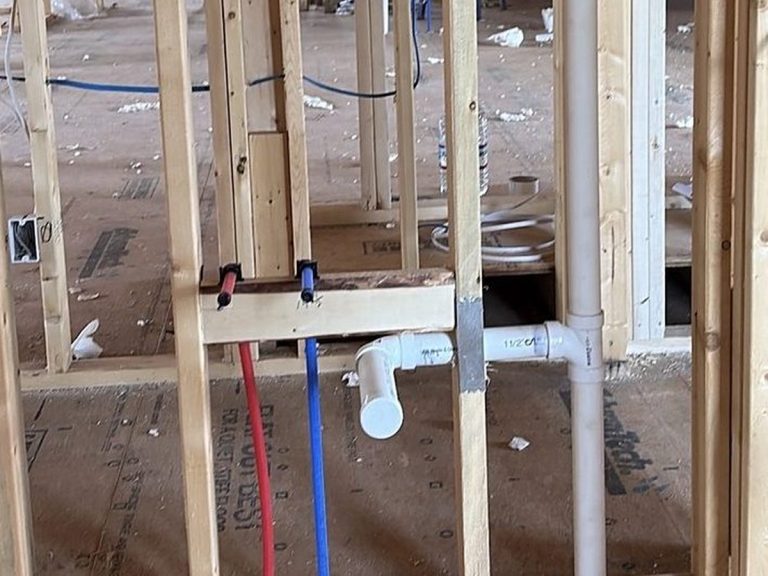 PEX and PVC lines roughed in between wall studs
