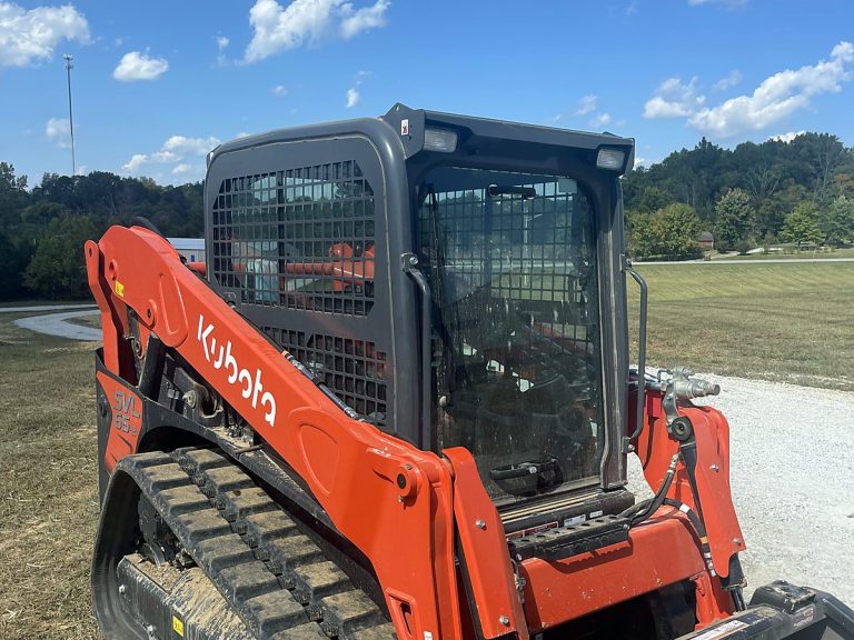 Orange Kubota skid steer on a job site
