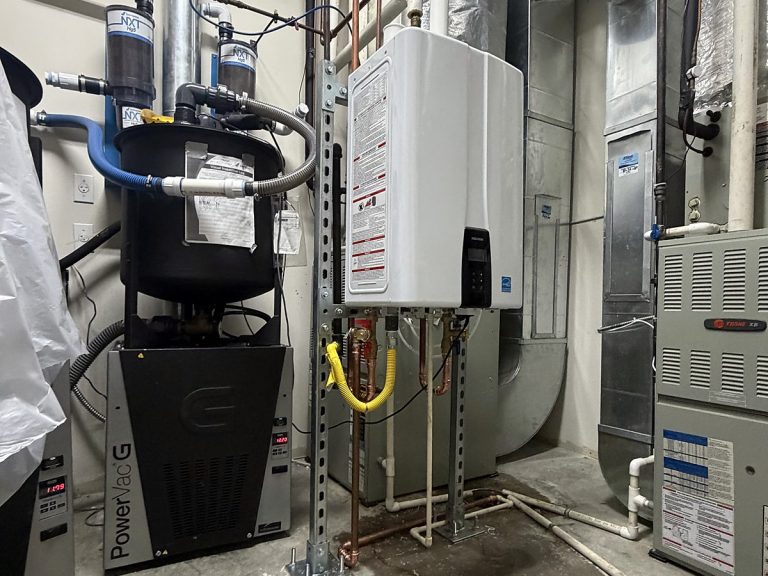 Tankless water heater and water softener in a utility room
