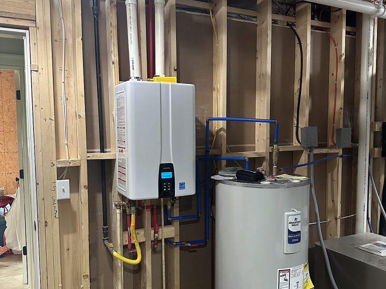 Tankless and tank water heaters in a framed utility room